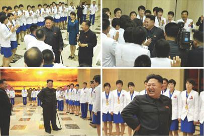 金正恩與運(yùn)動(dòng)員和教練一一握手,祝賀其取得佳績。(圖片來源:《勞動(dòng)新聞》)